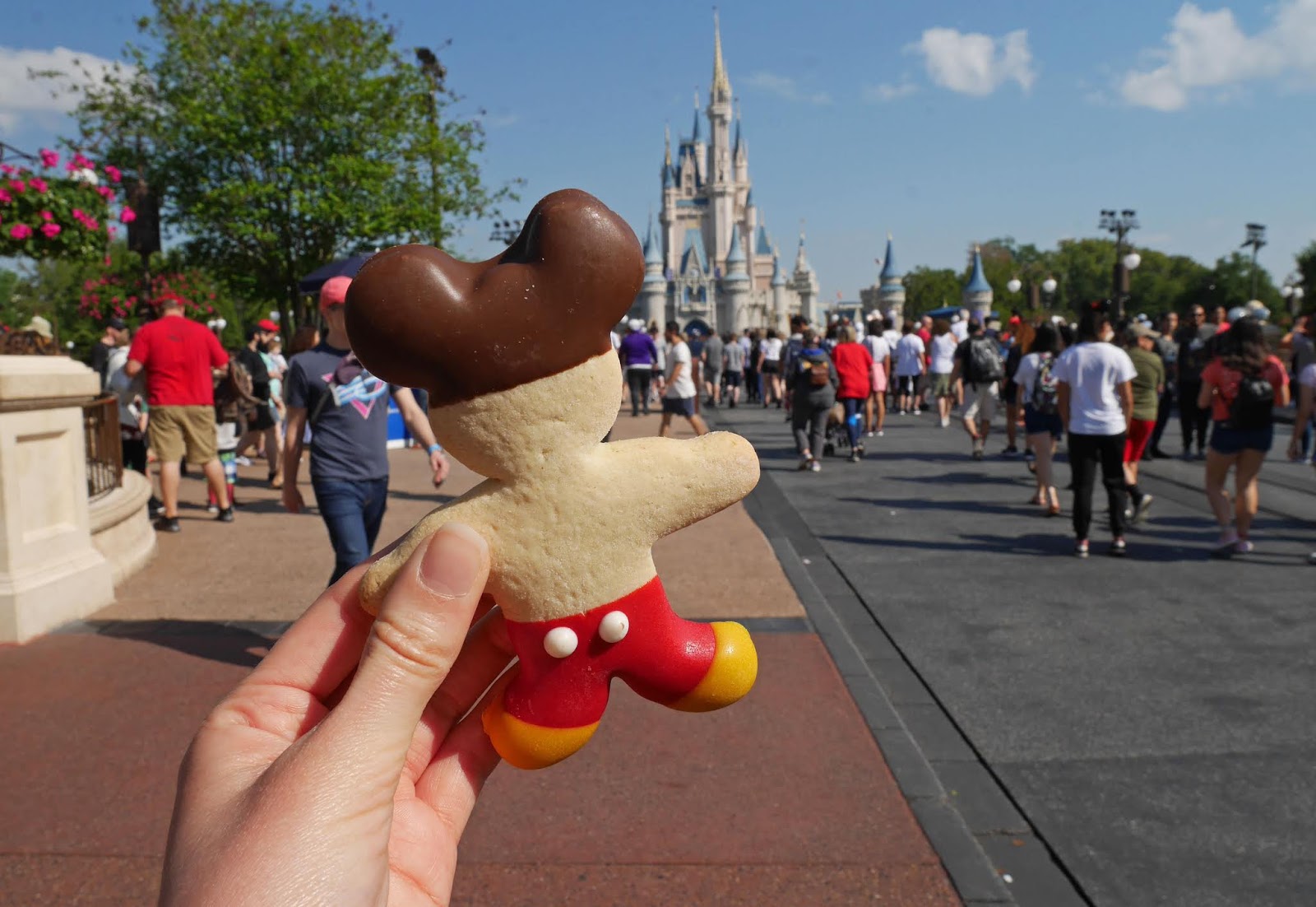 Eating a Mickey Mouse cookie at Disney's Magic Kingdom on our 4 park challenge day