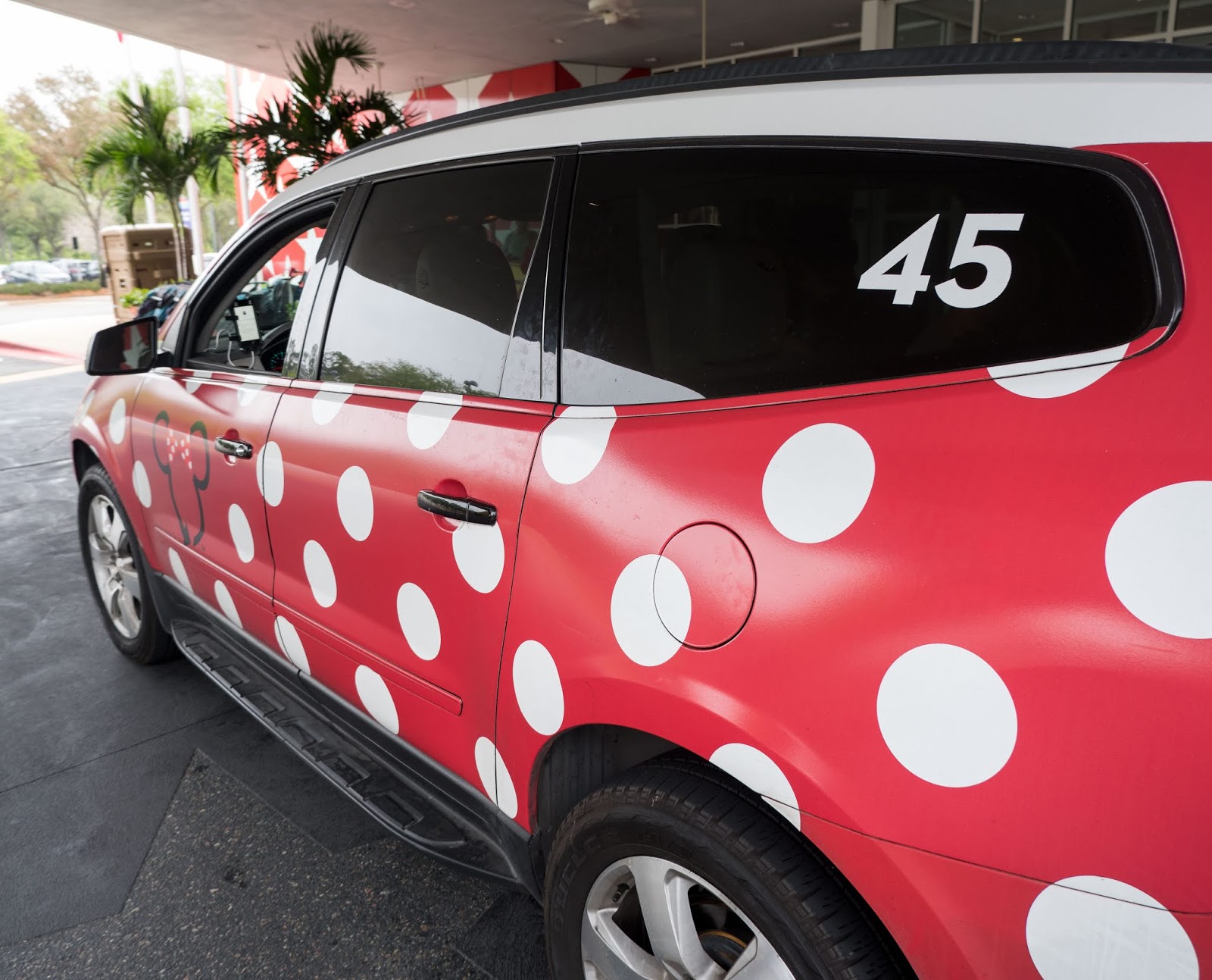 Minnie Mouse decorations on the side of one of the Walt Disney World Minnie Vans