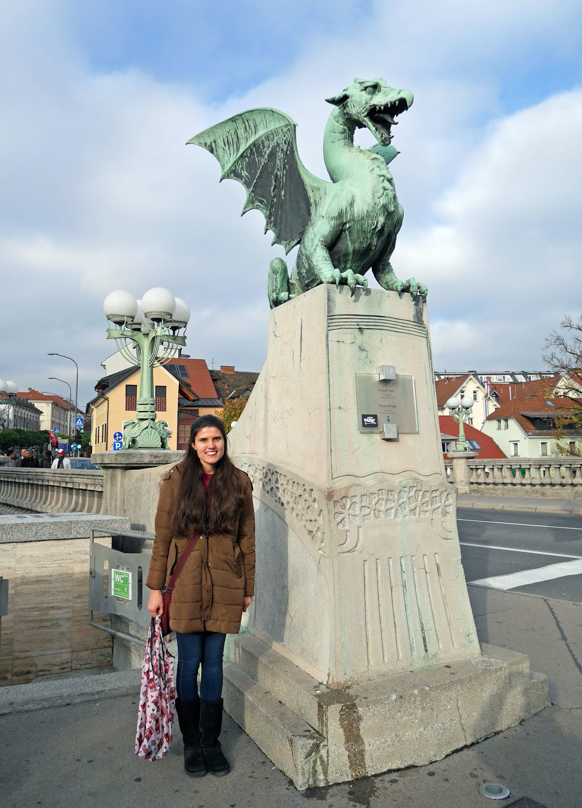 Kat Last standing by the Dragon Bridge in Ljubljana, Slovenia