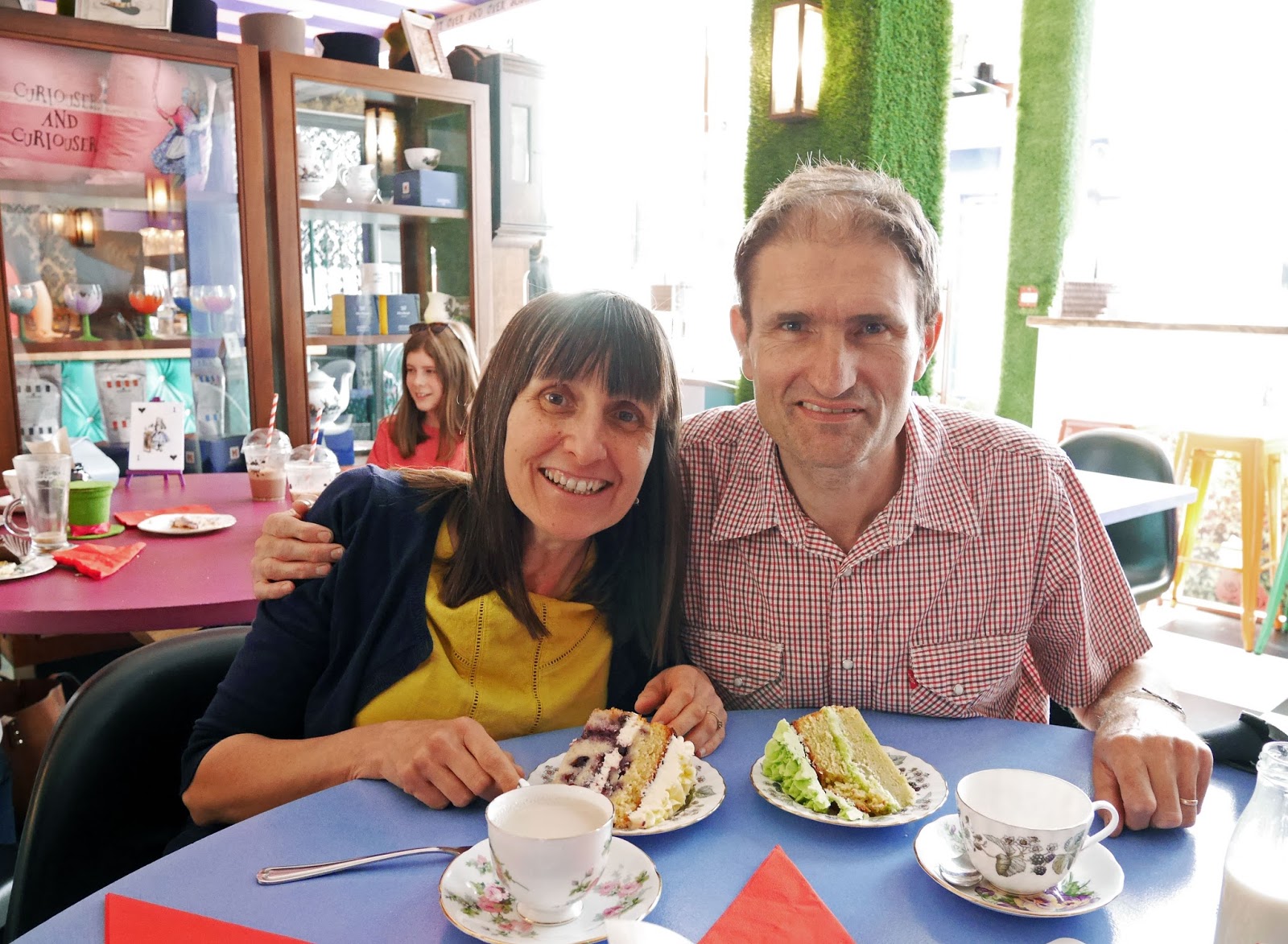 My parents with their cake at Alice and the Hatter, Canterbury