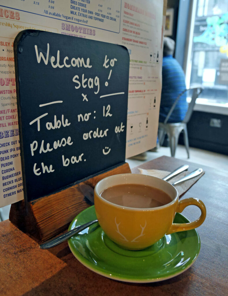 A table sign at Stag Coffee & Kitchen in Canterbury, Kent