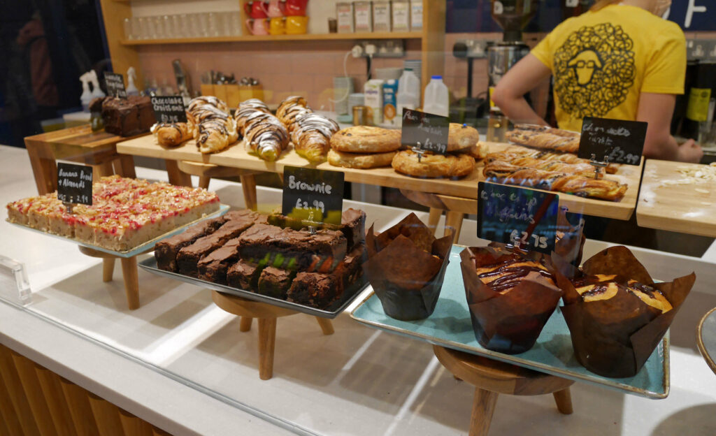 Cakes on display inside Lost Sheep Coffee and Kitchen, Canterbury