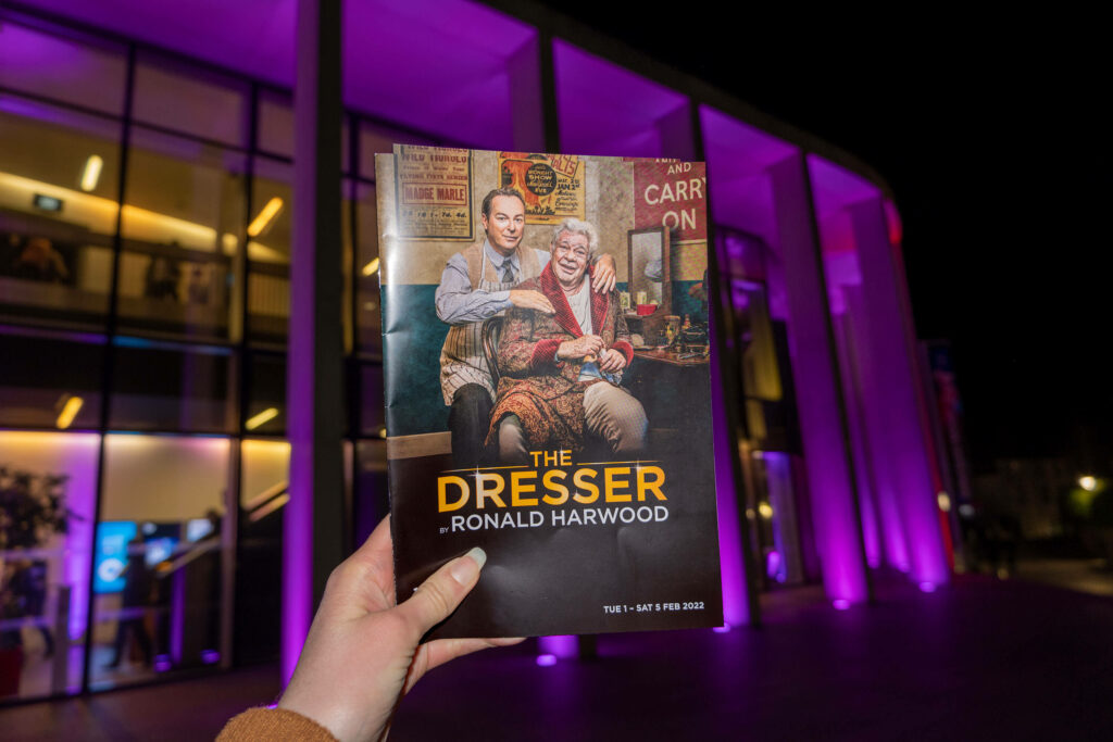 Holding the programme for The Dresser outside The Marlowe Theatre, Canterbury