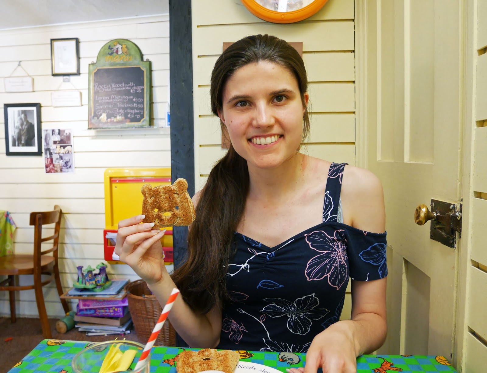 Kat Last holding Winnie the Pooh toast at Piglet's Tearoom in Ashdown Forest