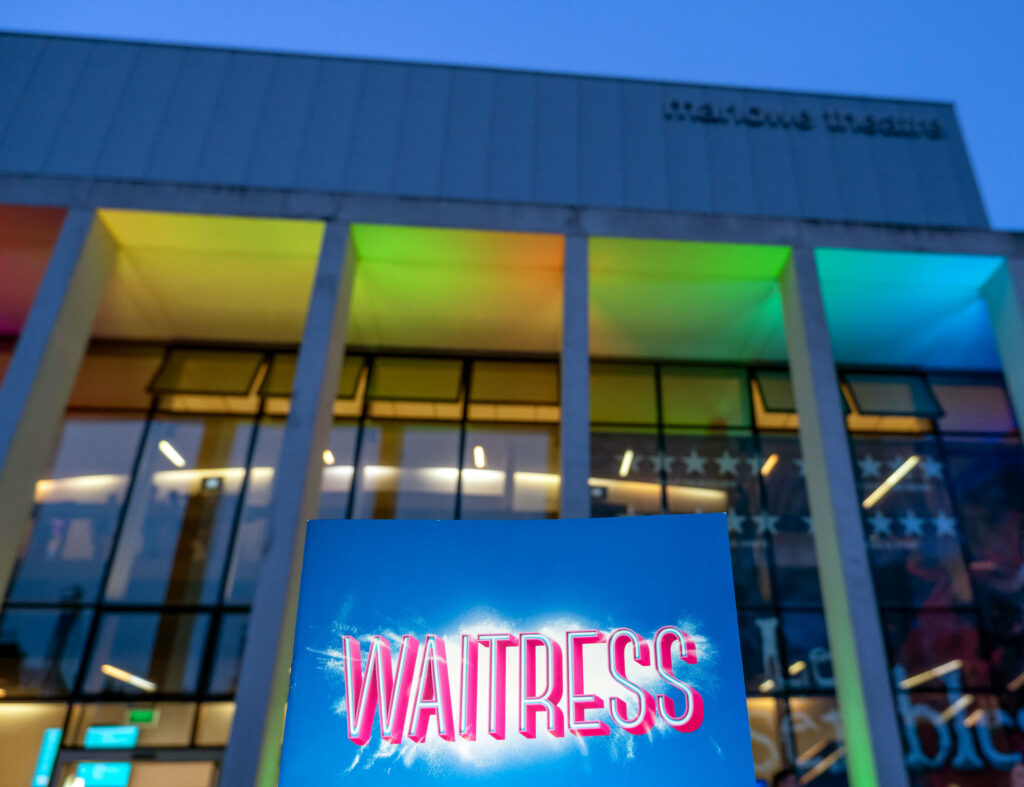 Waitress programme outside The Marlowe Theatre in Canterbury