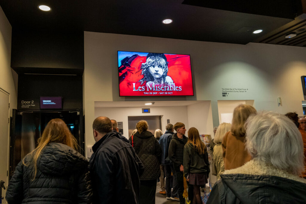 Les Misérables promotional screen in the foyer of The Marlowe Theatre, Canterbury
