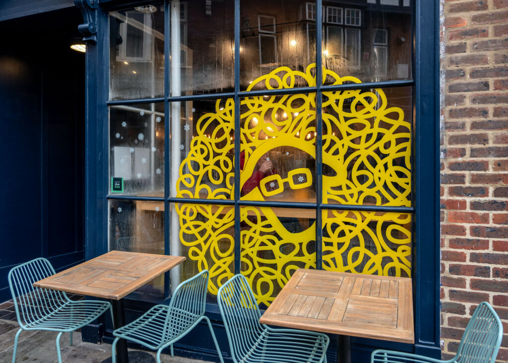 Snowflake decals in the window of Lost Sheep Coffee & Kitchen in Canterbury, Kent