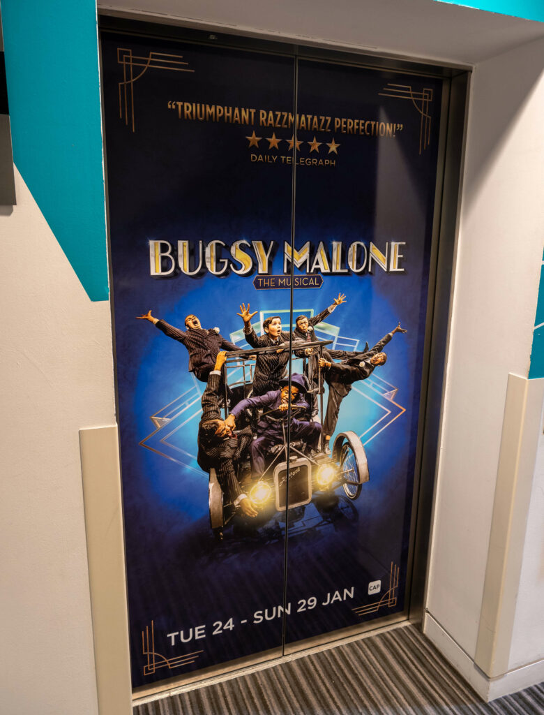 Bugsy Malone poster in the lobby of The Marlowe Theatre, Canterbury