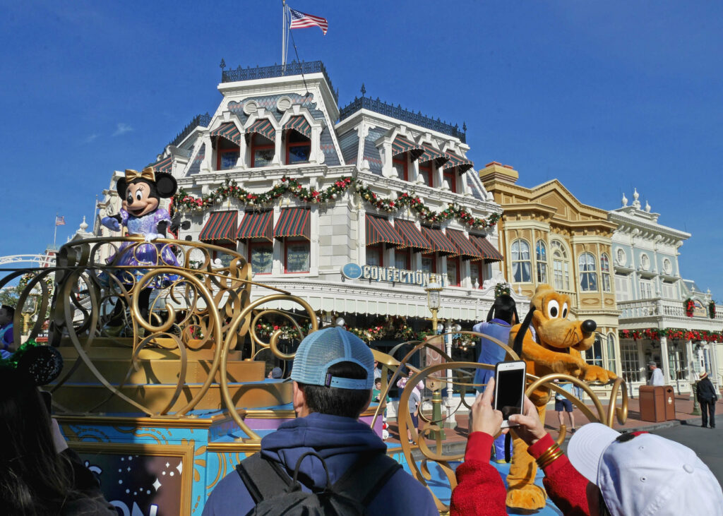 Celebration Calvacade parade on Magic Kingdom's Main Street U.S.A. during the festive season