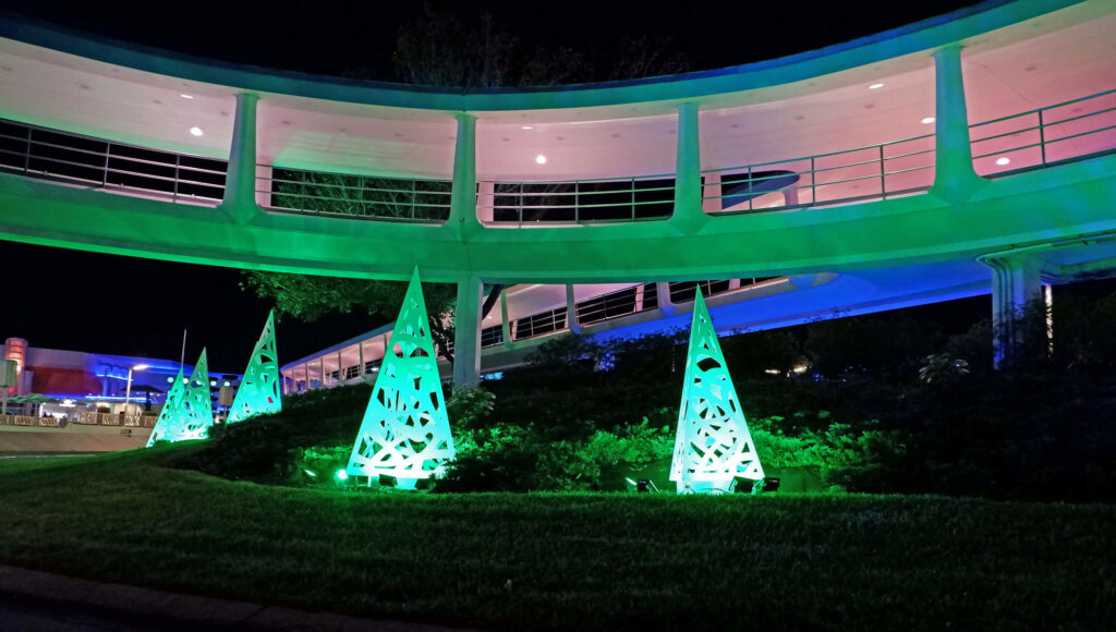 Festive theming on the Tomorrowland Speedway attraction at Mickey's Very Merry Christmas Party