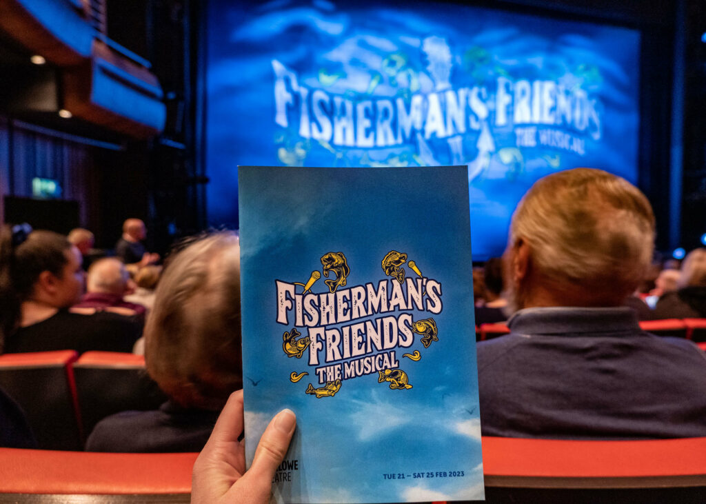 Fisherman's Friends the Musical programme in The Marlowe Theatre's auditorium