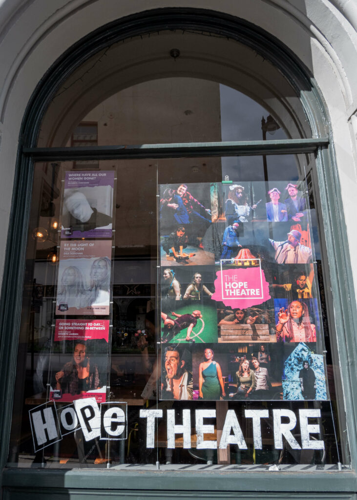 The what's on display in the window of The Hope Theatre, Islington