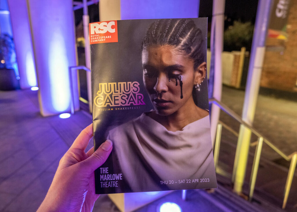 Julius Caesar programme outside The Marlowe Theatre, Canterbury