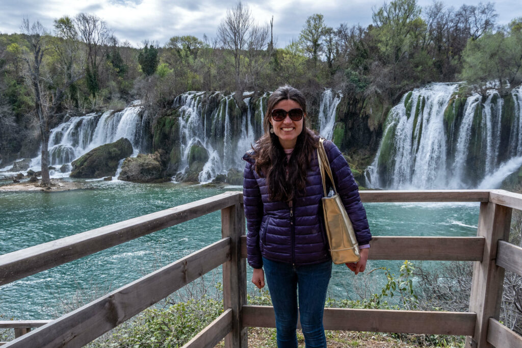 Kat Masterson in front of the Kravice Waterfalls in Bosnia and Herzegovina