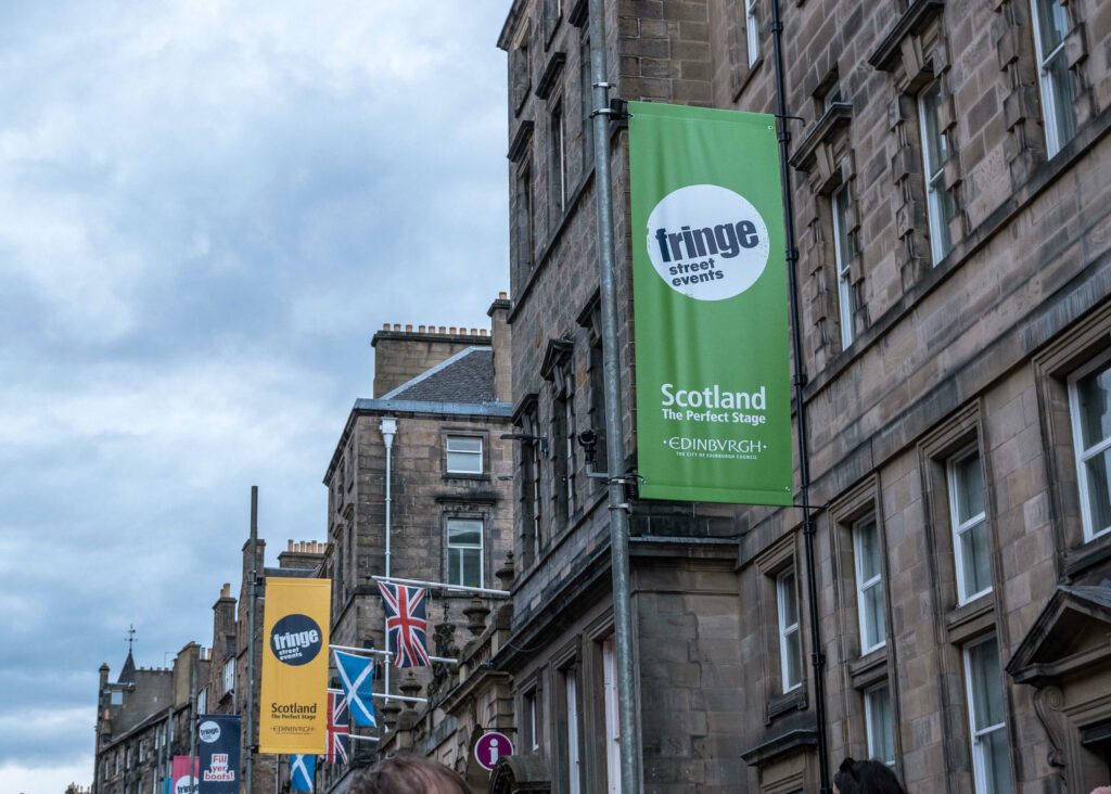 Edinburgh Fringe street events posters on the Royal Mile