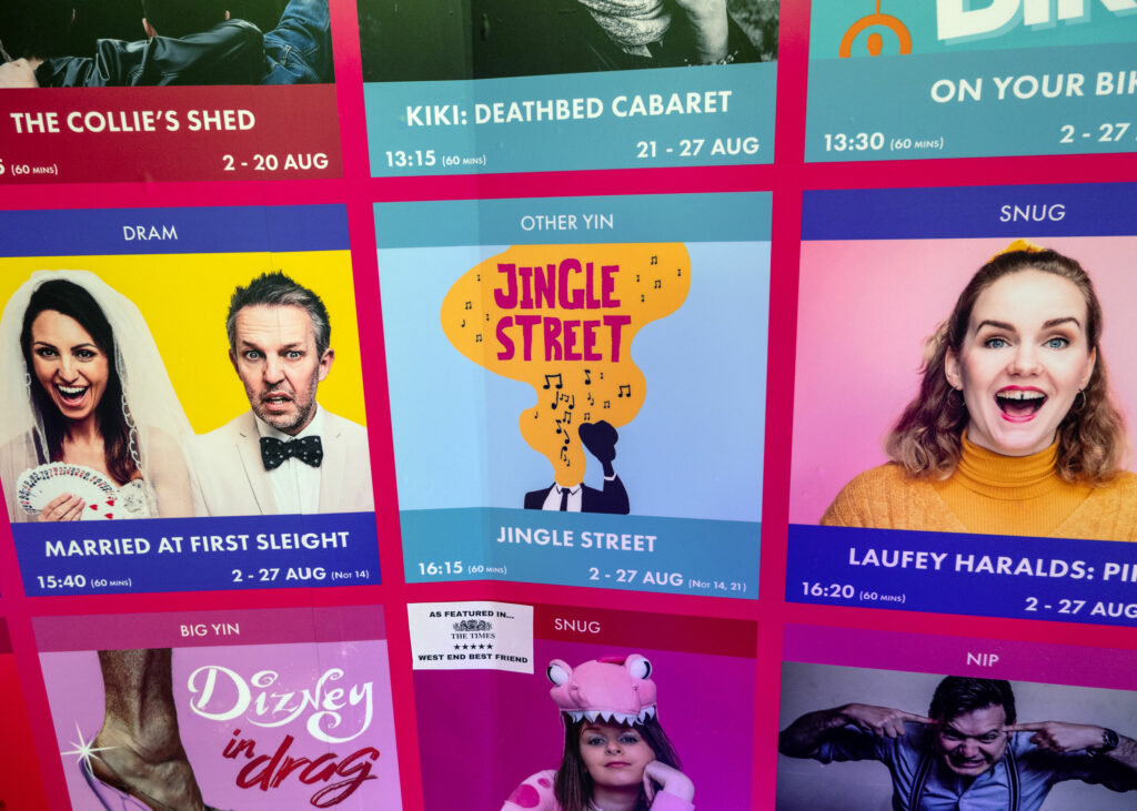 Jingle Street on the Gilded Balloon Patter Hoose promotional wall, Edinburgh Fringe