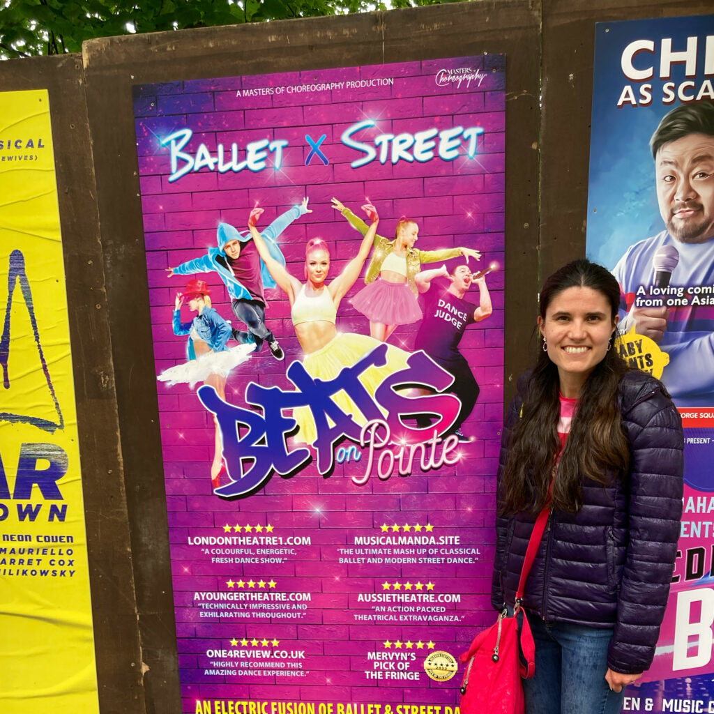 Kat Masterson next to a poster for Beats on Pointe at the Edinburgh Fringe