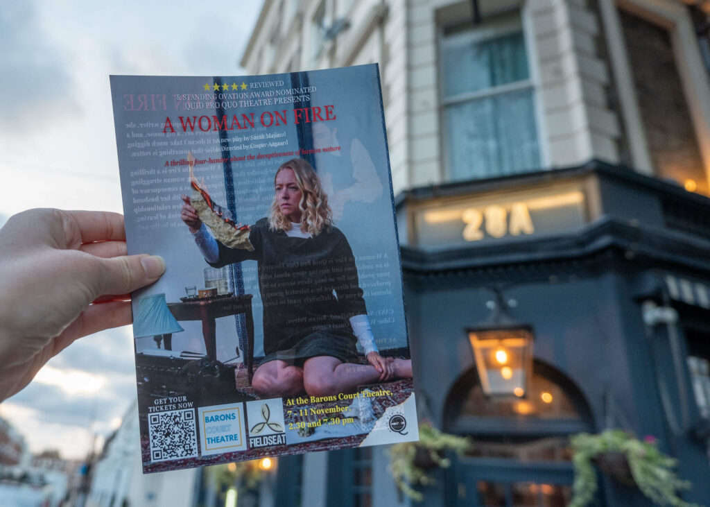 A Woman On Fire leaflet outside Barons Court Theatre, London