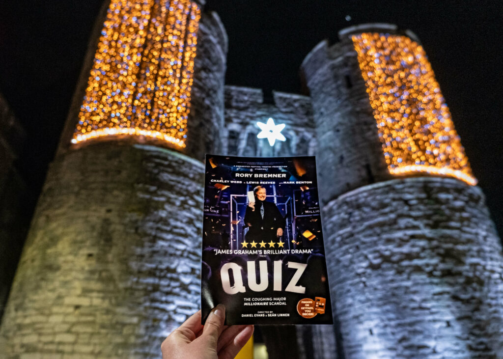 Quiz the play leaflet in front of the Westgate Towers, Canterbury
