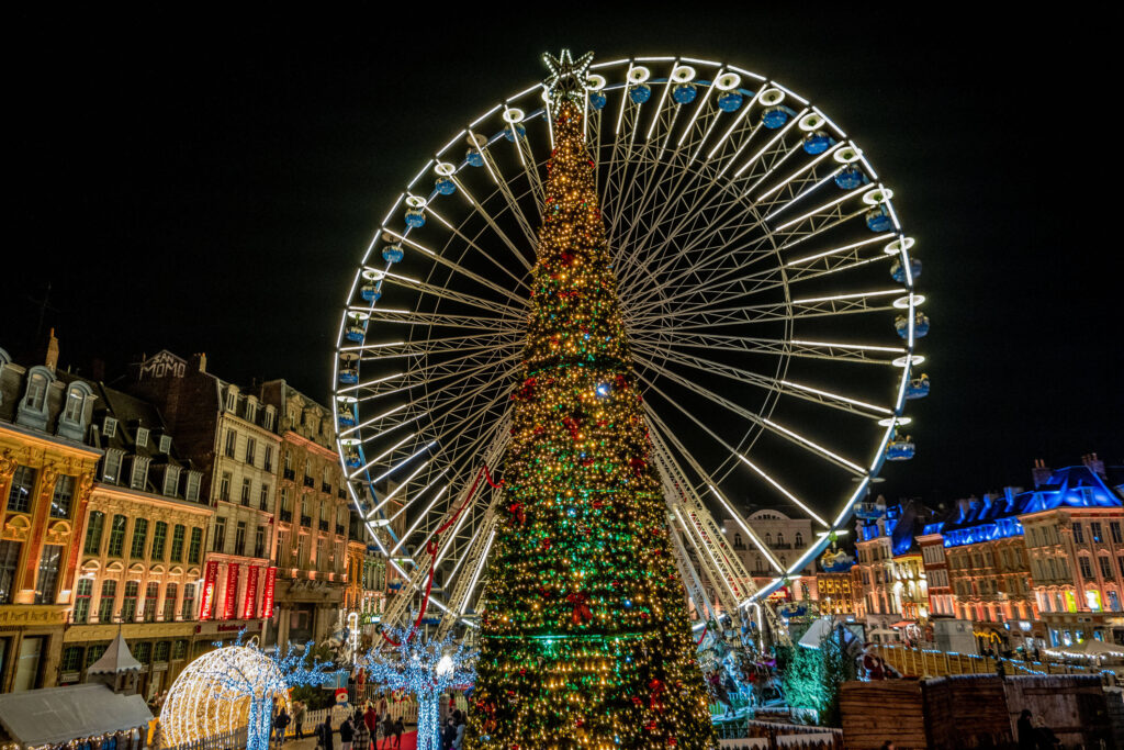 Chrismas tree and ferris wheel in in Lille Grand Place, France