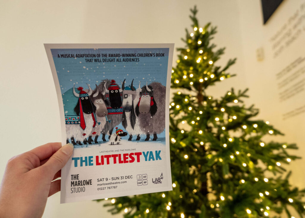 The Littlest Yak leaflet in front of The Marlowe Theatre Christmas tree, Canterbury