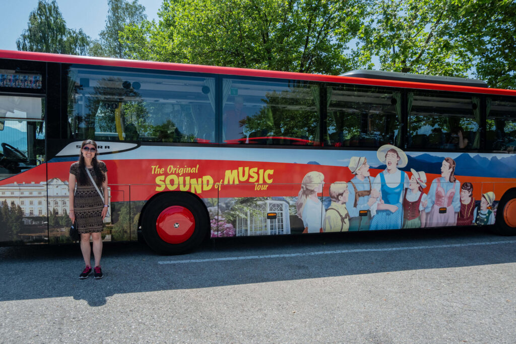 Kat Masterson next to the Original Sound of Music Tour bus in Salzburg, Austria