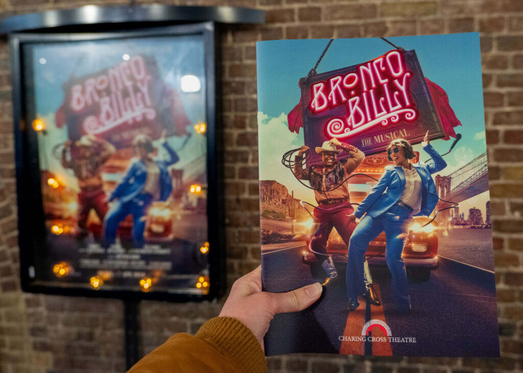 Bronco Billy programme and poster outside the Charing Cross Theatre, London