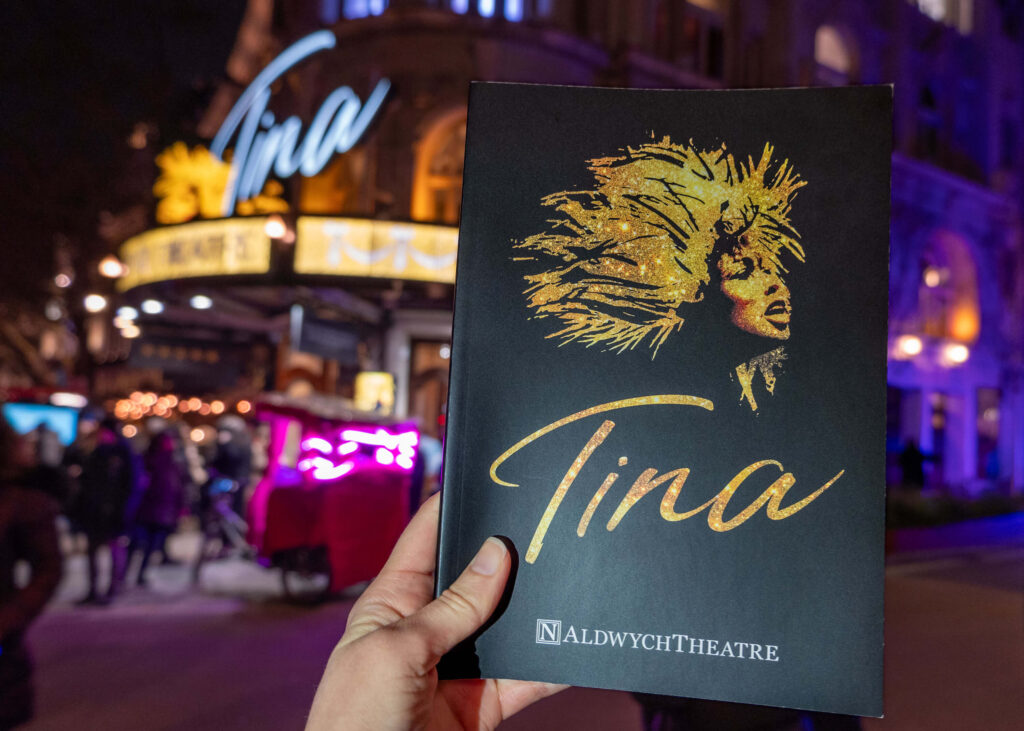 TINA: The Tina Turner Musical programme outside The Aldwych Theatre, London