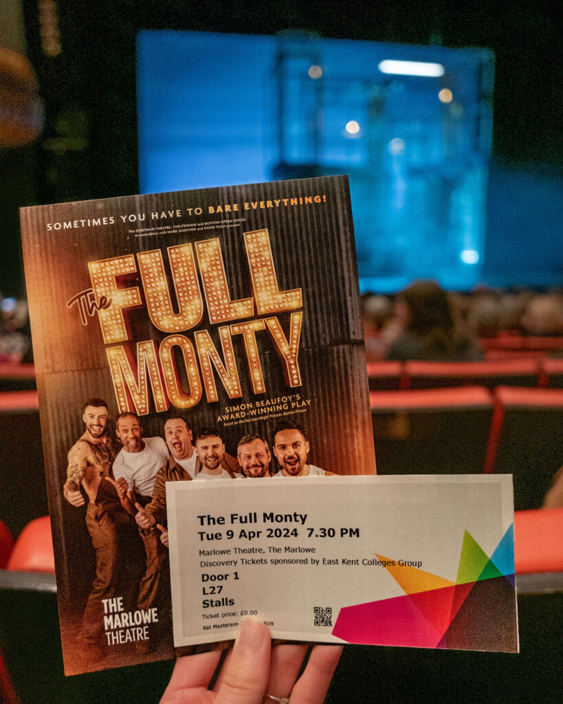 The Full Monty ticket and programme in front of the stage at The Marlowe Theatre, Canterbury