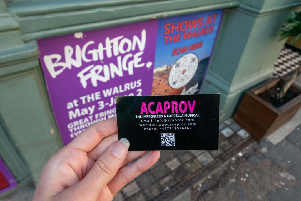 Acaprov: The Improvised A Cappella Musical promotional card outside The Walrus, Brighton Fringe