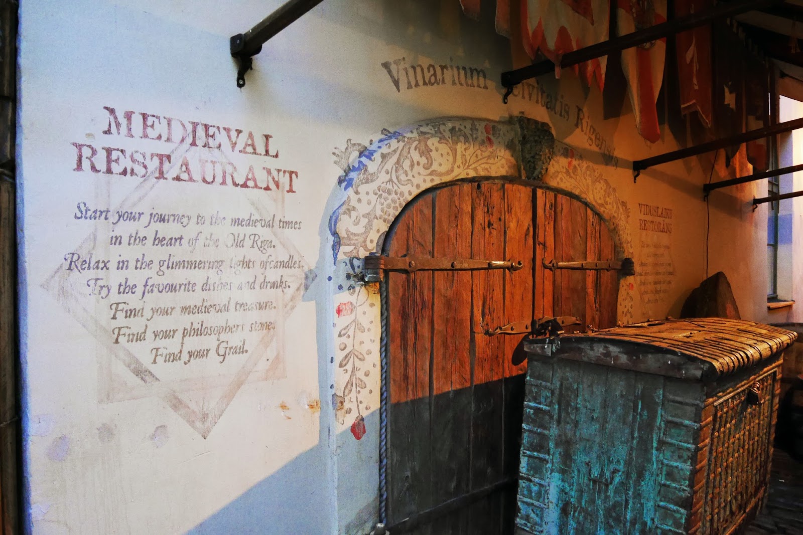 Medieval decor and signage outside Rozengrāls Medieval Restaurant in Riga, Latvia