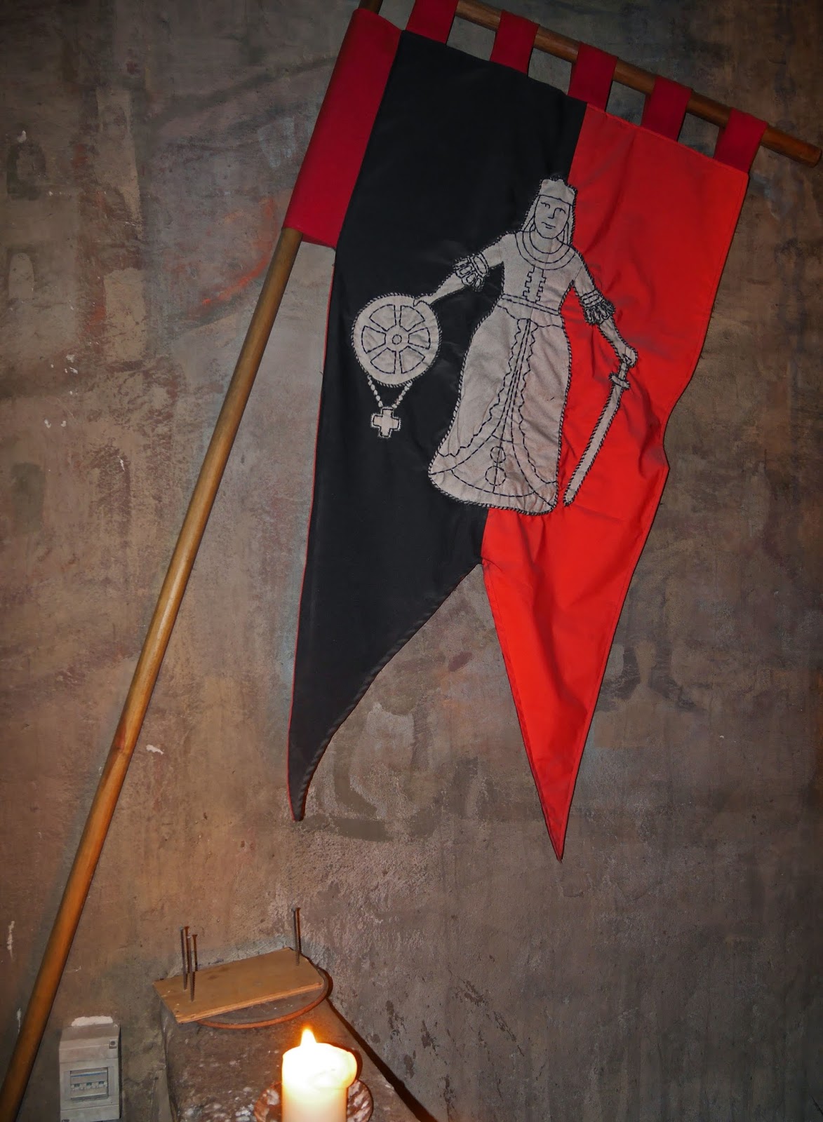 Medieval flag at the entrance to Rozengrāls Medieval Restaurant in Riga, Latvia