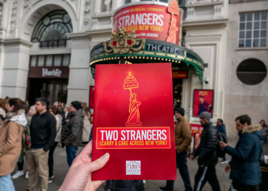 Two Strangers (Carry a Cake Across New York) programme outside the Criterion Theatre, London