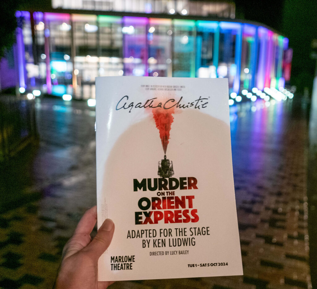 Murder on the Orient Express programme in front of the Marlowe Theatre, Canterbury