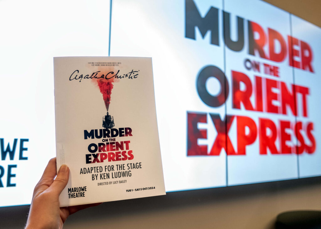 Murder on the Orient Express programme in front of the Marlowe Theatre digital billboard, Canterbury