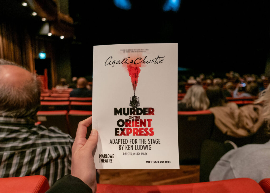 Murder on the Orient Express programme in front of the Marlowe Theatre stage, Canterbury