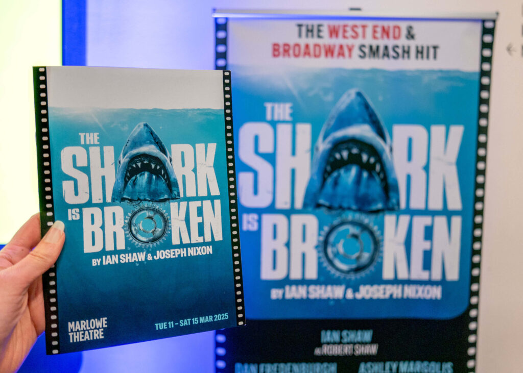 The Shark is Broken programme in front of the poster in the Marlowe Theatre lobby, Canterbury