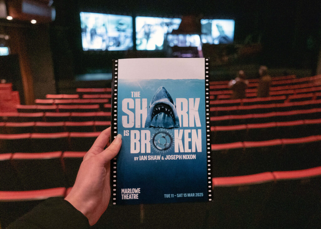 The Shark is Broken programme in front of the Marlowe Theatre stage, Canterbury